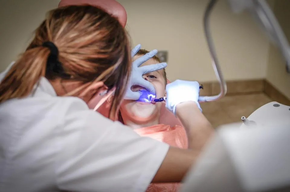 A dentist treating a patient